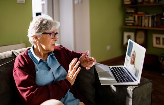 A mature lady in an online counselling session with Charlotte. Online sessions are one of the more convenient types of counselling available from the practice..